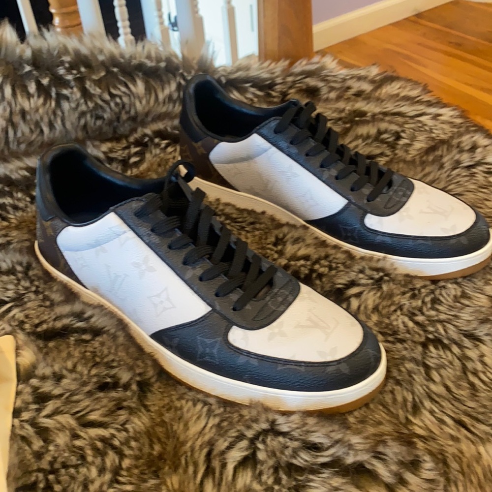 Louis Vuitton Rivoli Sneaker size 10 fits 11.  Tight on me I wear 11.5.